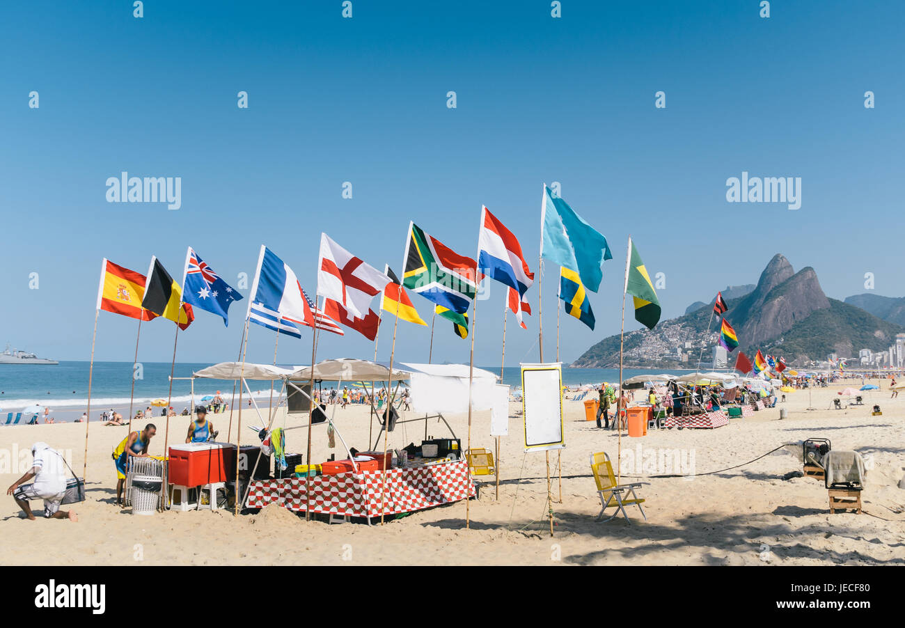 International flags at Ipanema in Rio de Janeiro, Brazil. An iconic beach full of beautiful and sexy people Stock Photo