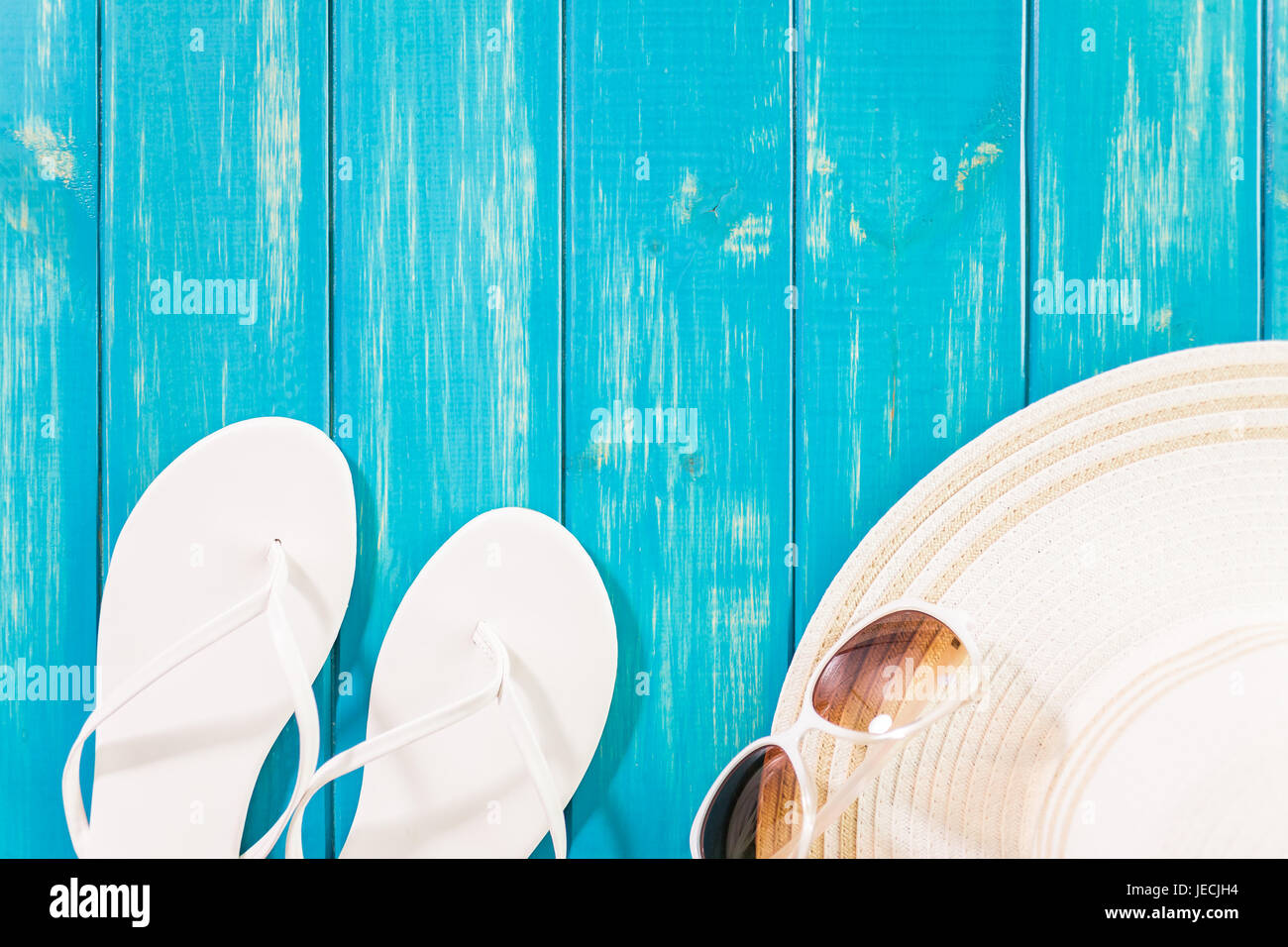 Women's sun hat with flip flops and sunglasses Stock Photo - Alamy