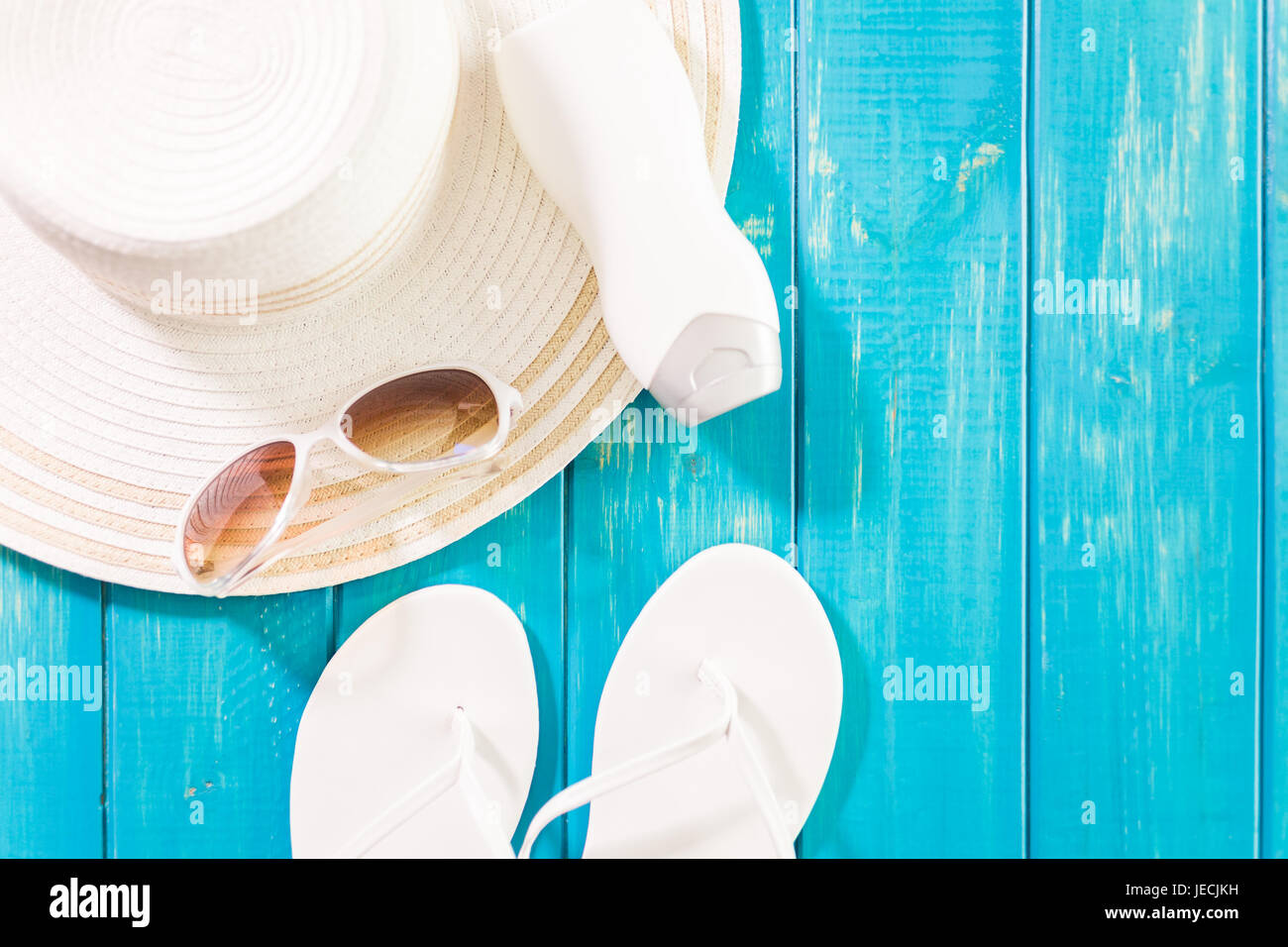 Women's sun hat with flip flops and sunglasses Stock Photo - Alamy