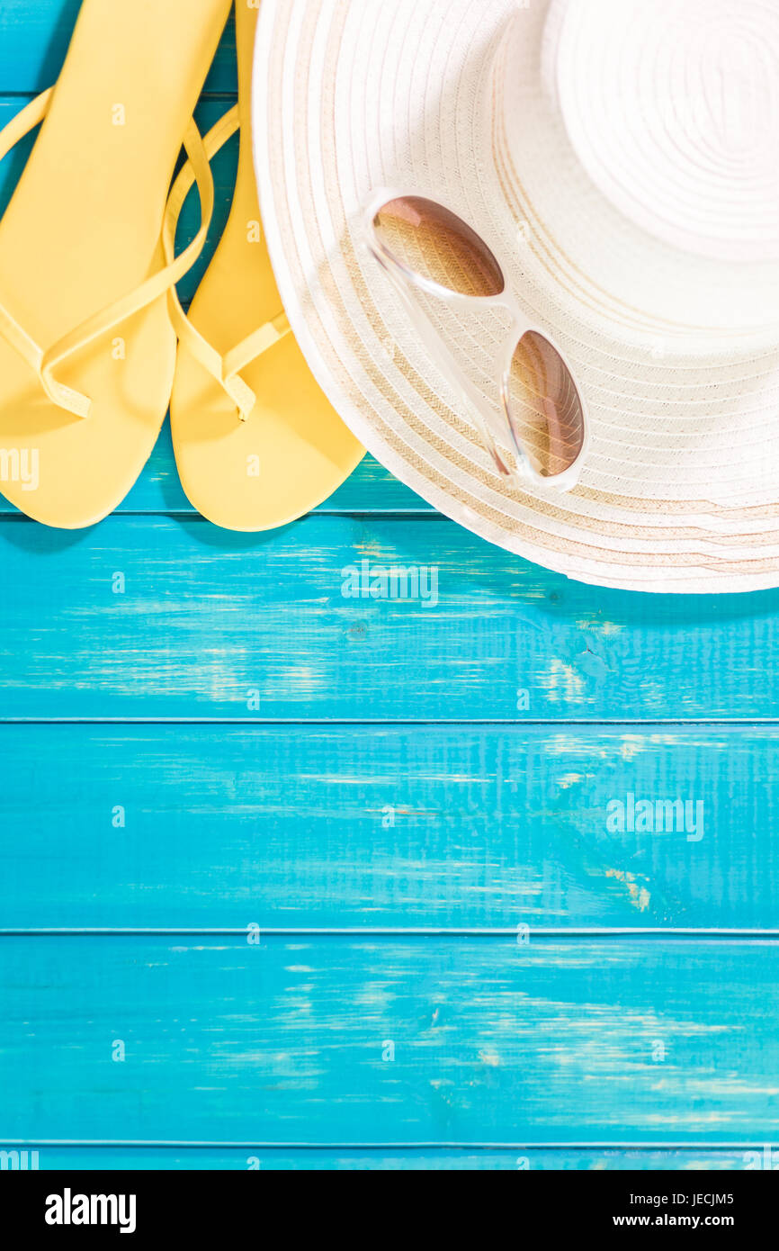Women's sun hat with flip flops and sunglasses Stock Photo - Alamy