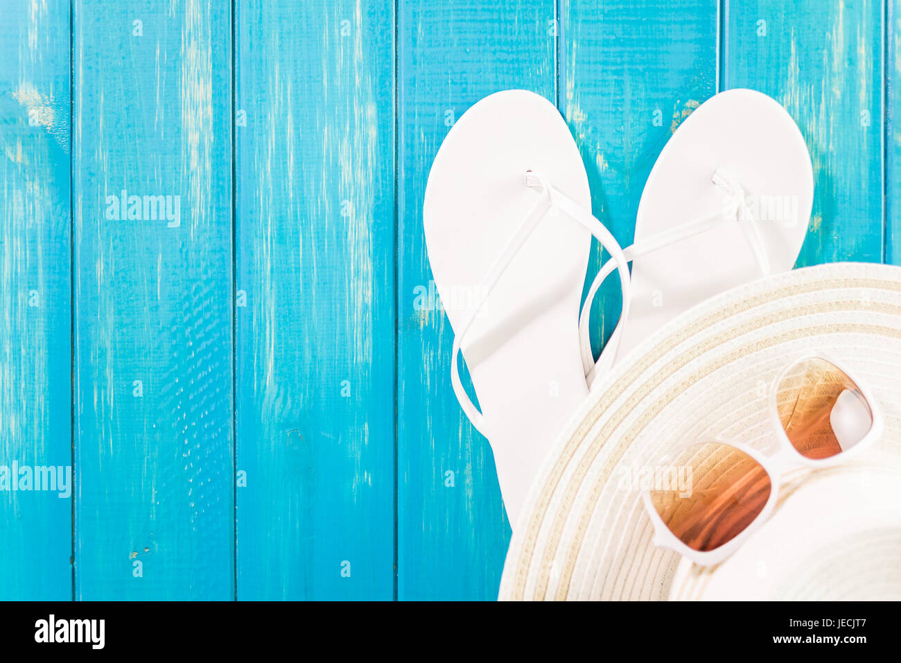 Women's sun hat with flip flops and sunglasses Stock Photo - Alamy