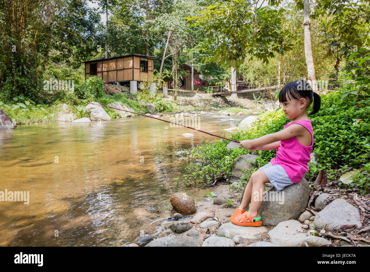 Thai woman with pole for fishing Stock Photo - Alamy