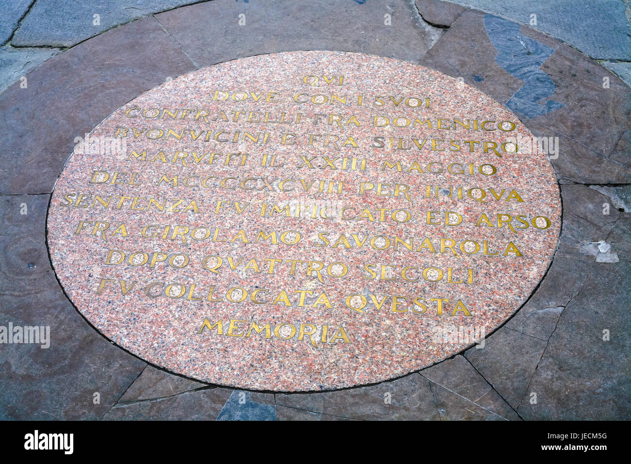 travel to Italy - plaque in pavement on site where Italian Dominican friar Savonarola was burnt on Piazza della Signoria in Florence city on 23 May 14 Stock Photo