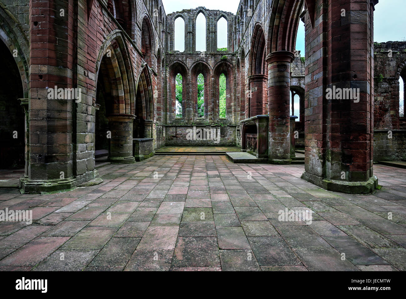 Stone Priory Stone arches, columns and windows, ruins of Lanercost Priory, North ...