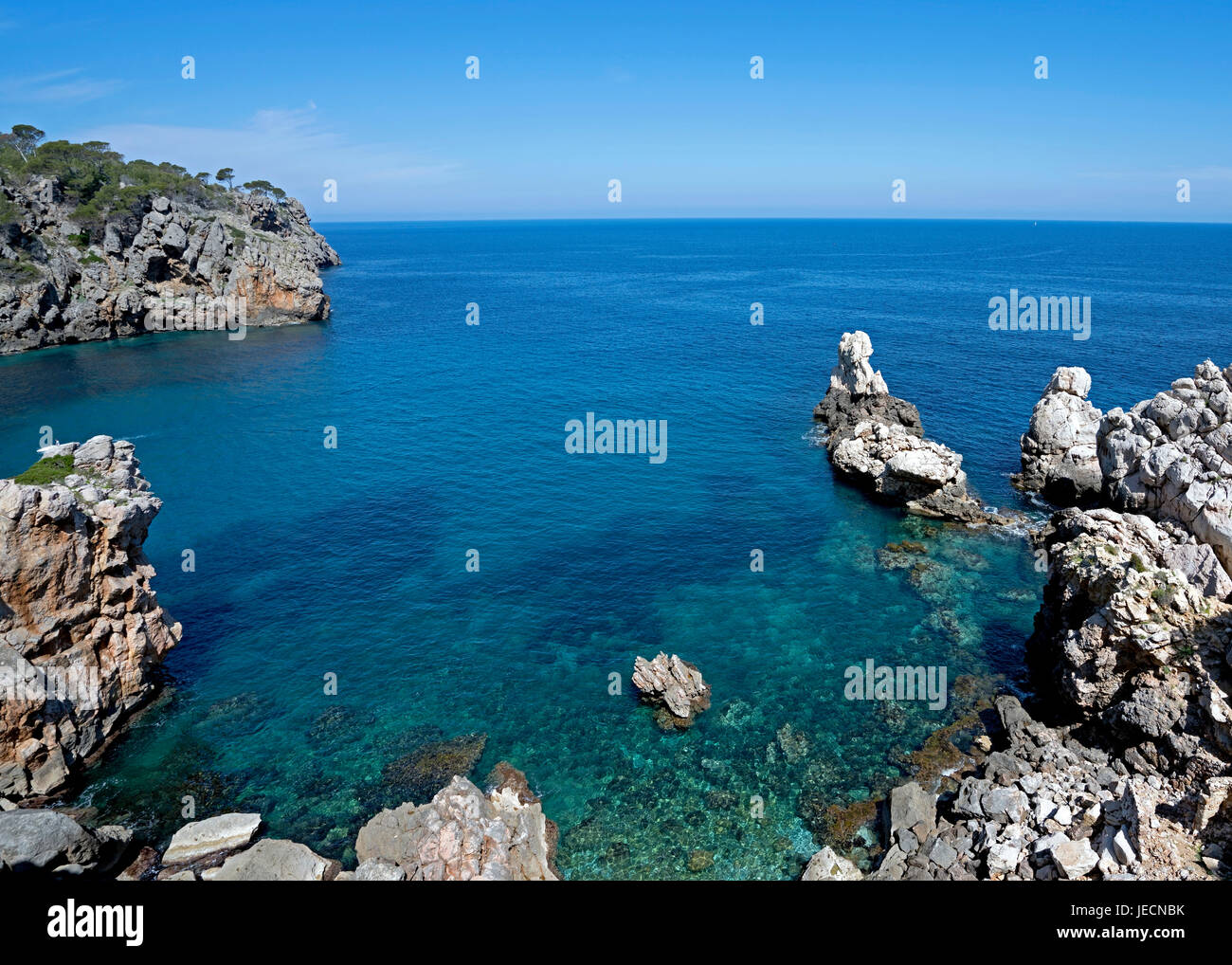 Rocky Shoreline of Deia in Tramuntana Mountains, Majorca, Balearic Island of Spain Stock Photo