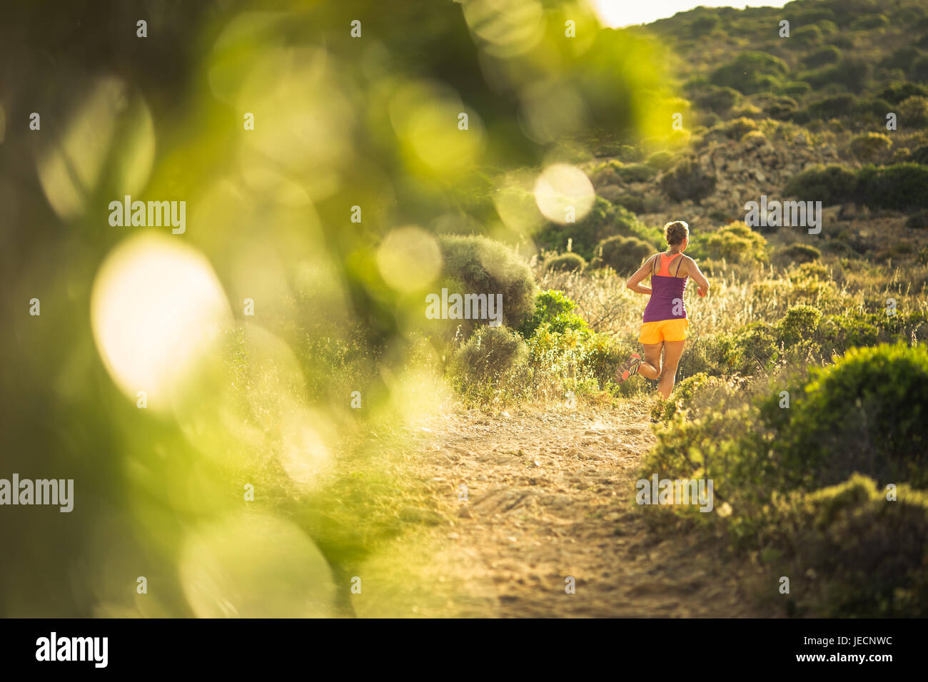 Young woman running outdoors on a lovely sunny day Stock Photo - Alamy