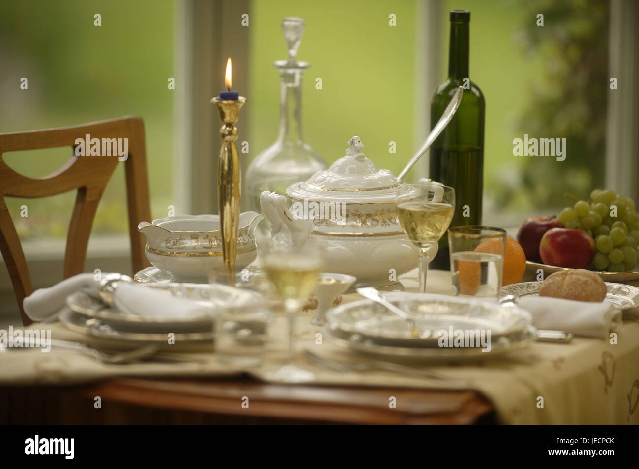 Table, covered, porcelain, elegantly, dishes, china, covers, plates, sauceboat, soup tureen, tureen, wine, wine flask, wineglasses, glasses, decanter, water, fruit plate, fruit, grapes, apples, orange, brass candlestick, skyer, candle-light, festively, flatware, chair, window, nobody, Stock Photo