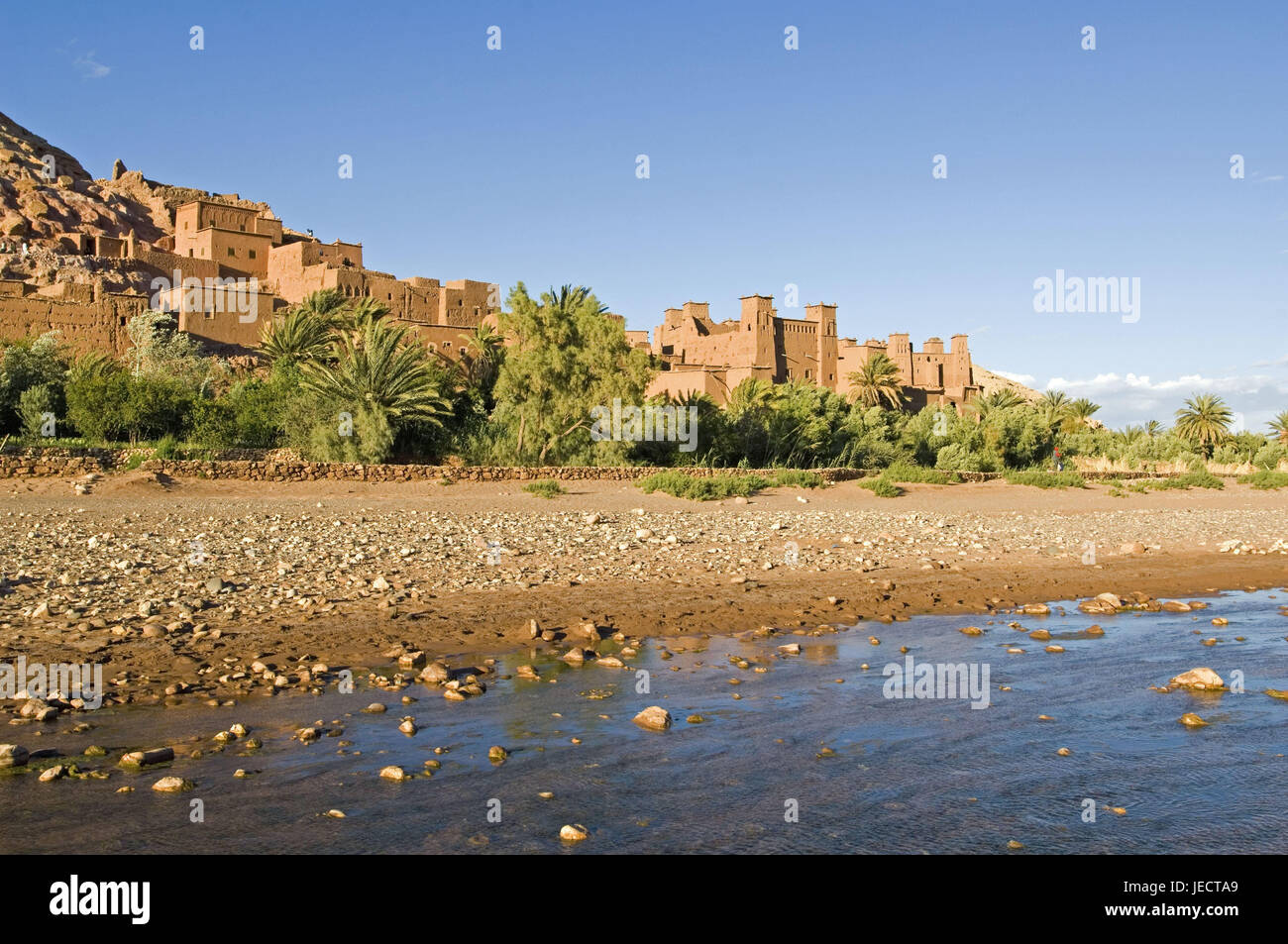 Morocco, Aït-Ben-Haddou, local view, riverside, Africa, North Africa, place, Ksar, houses, mucky construction method, typically, typically for country, mucky houses, architecture, mucky architecture, river, shore, stones, palms, vegetation, outside, deserted, place of interest, UNESCO-world cultural heritage, destination, Stock Photo