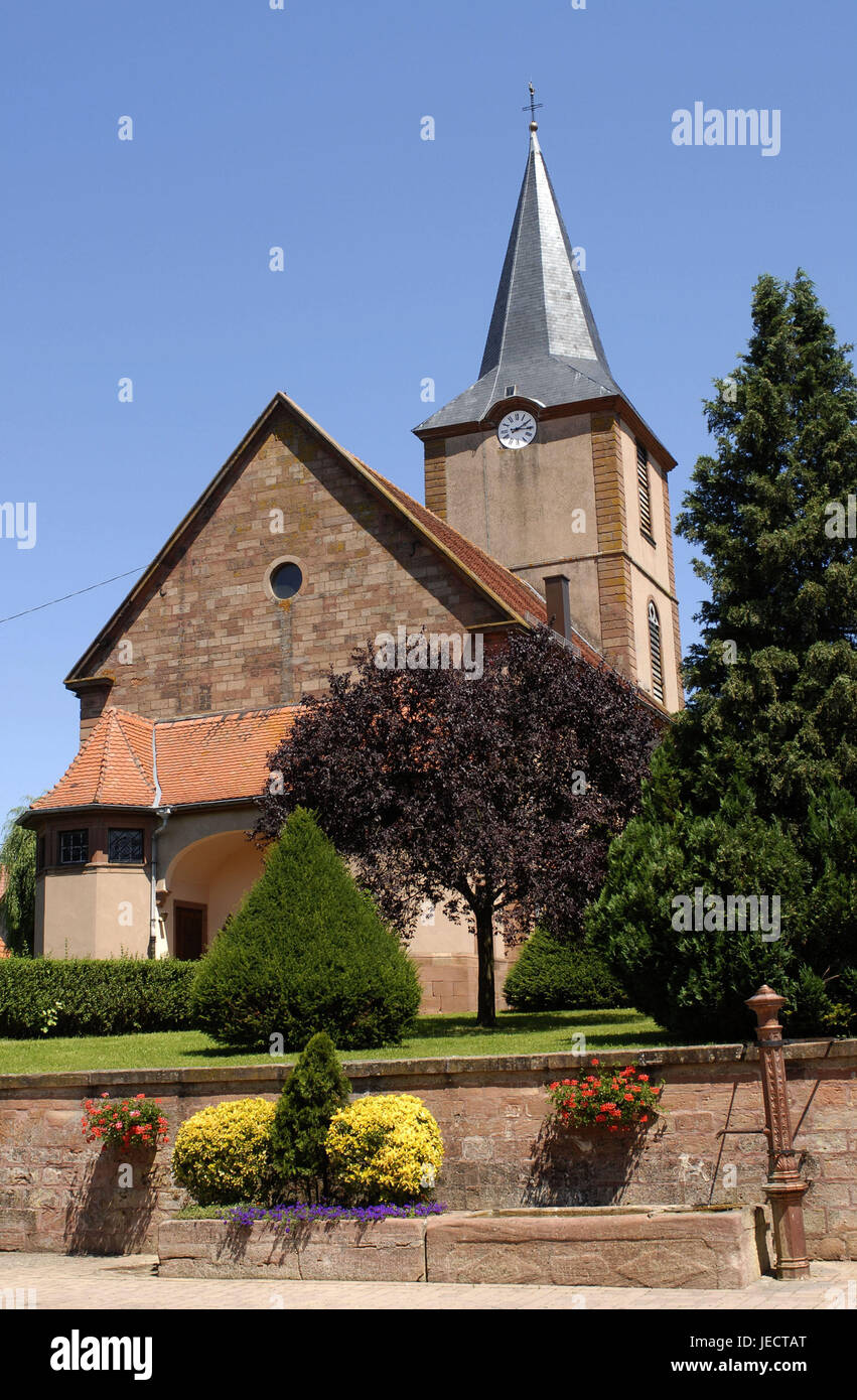 France, Alsace, Bas-Rhin, Kirrwiller, church, place, faith, religion, Christianity, Protestant, church, sacred construction, architecture, steeple, clock, cross, sky, blue, cloudless, outside, trees, flowers, wells, deserted, Stock Photo