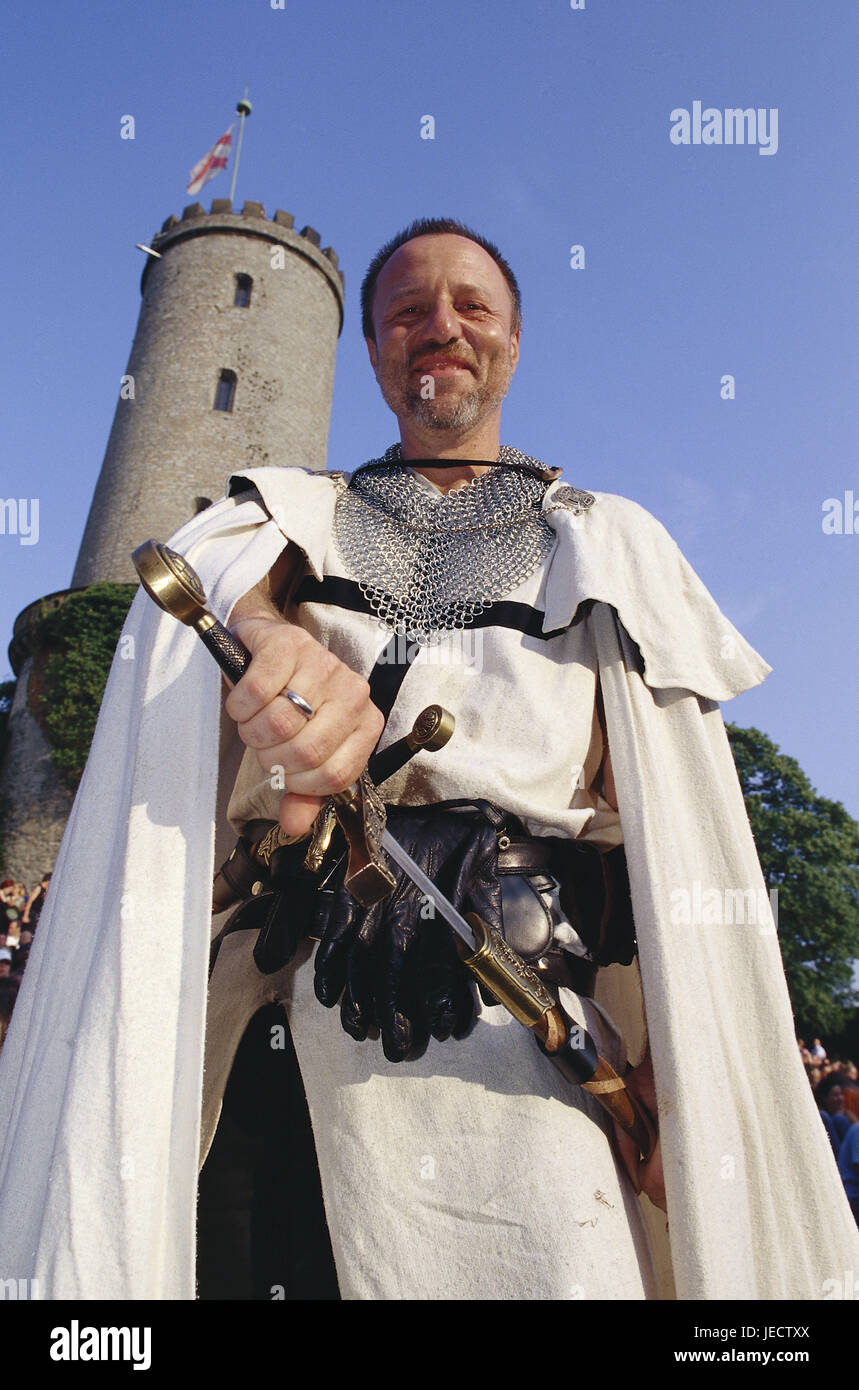 Germany, North Rhine-Westphalia, Bielefeld, rafter castle, feast, knight, sword, tower, Teutoburger wood, rafter mountain, castle, fortress, castle grounds, fortress attachment, event, fairground, round tower, person, actor, actor, man, knight's costume, costume, medievally, Middle Ages feast, stand, Openair, Openairveranstaltung, structure, historically, place of interest, rafter castle feast, leisure time, entertainment, outside, Stock Photo