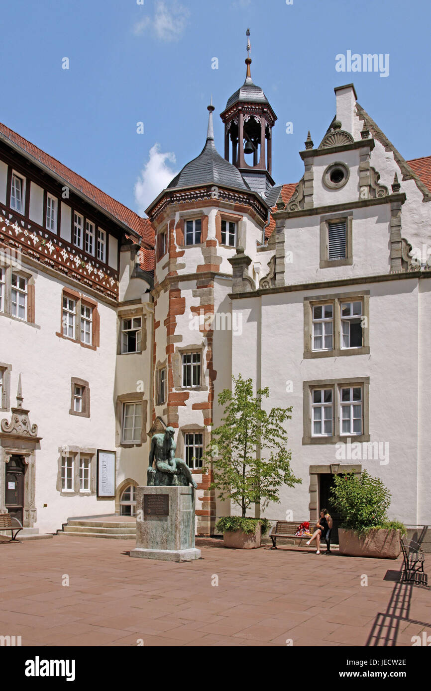 Germany, Hessen, Bad Hersfeld, city hall, outside, Old Town, square, building, statue, tower, bell, person, woman, saddle, sunshine, Stock Photo