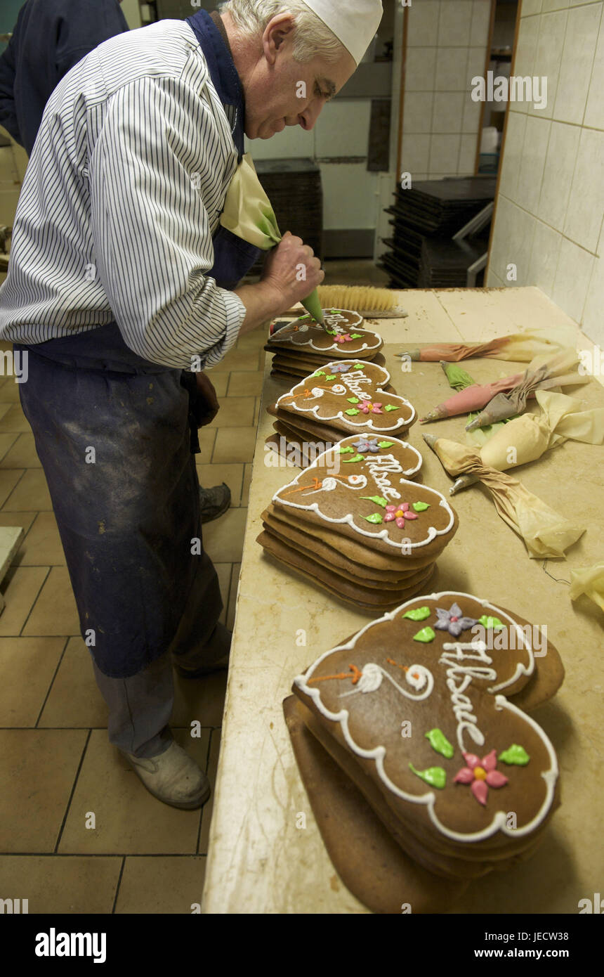 France, Bas-Rhin, Gertwiller, baker's Lips, confectioner decorates gingerbread, Stock Photo