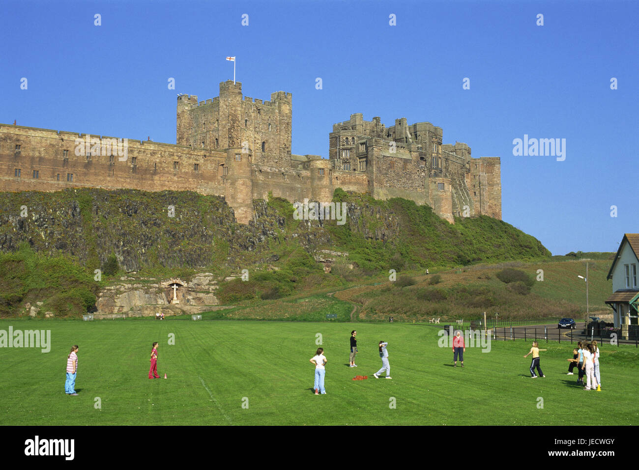 Great Britain, England, Northumbria, Bamburgh, lock, meadow, children, baseball game, no model release, Europe, Northumberland, places of interest, people, culture, historically, scenery, building, architecture, tourism, landmark, fortress, person, game, play, outside, Stock Photo