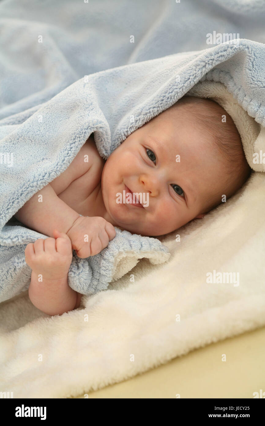 Baby, 4 months, lie, soft caps, view camera, Stock Photo