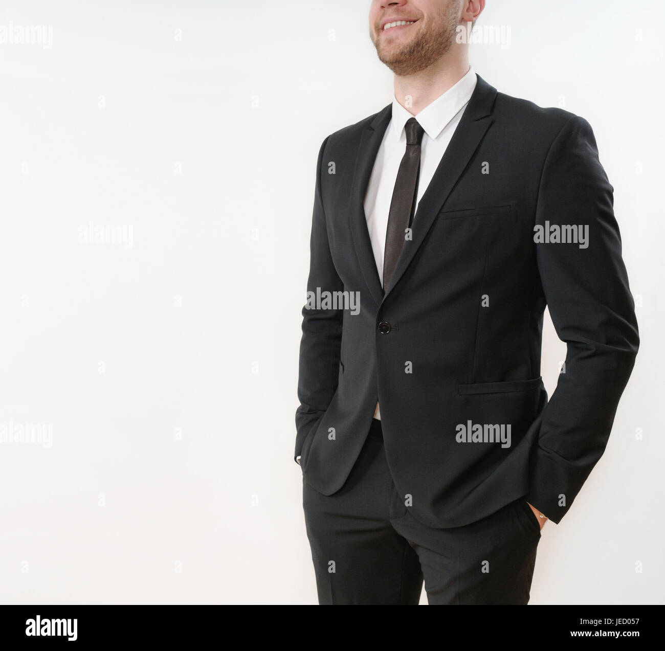close up part of smiling business man in black suit with hands in ...