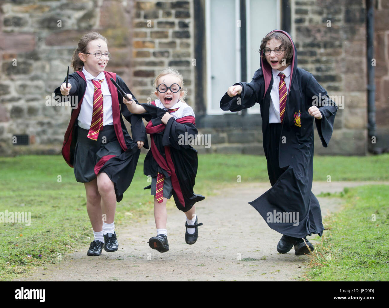 (From the left) Amy Burns, Alice Burns and Rosemary Caller dressed as Harry Potter at Smithills Hall in Bolton, before an attempt to break the Guinness World Record for the Largest Gathering of People Dressed as the boy wizard. Stock Photo