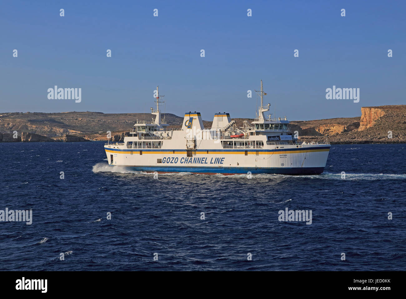 Gozo Channel Line ferry ship passing island of Comino on crossing to