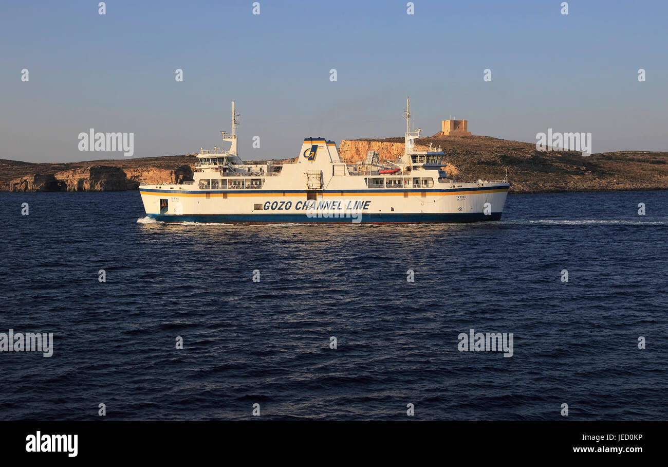 Gozo Channel Line ferry ship passing island of Comino on crossing to