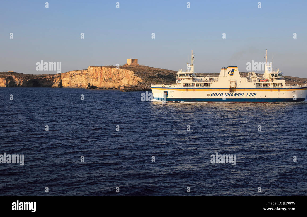 Gozo Channel Line ferry ship passing island of Comino on crossing to