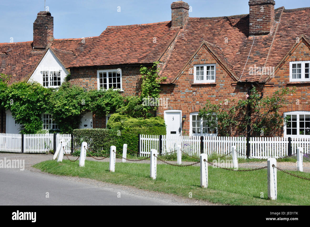 Period cottages at Little Missenden - by the village green - summer sunlight and blue sky Stock Photo