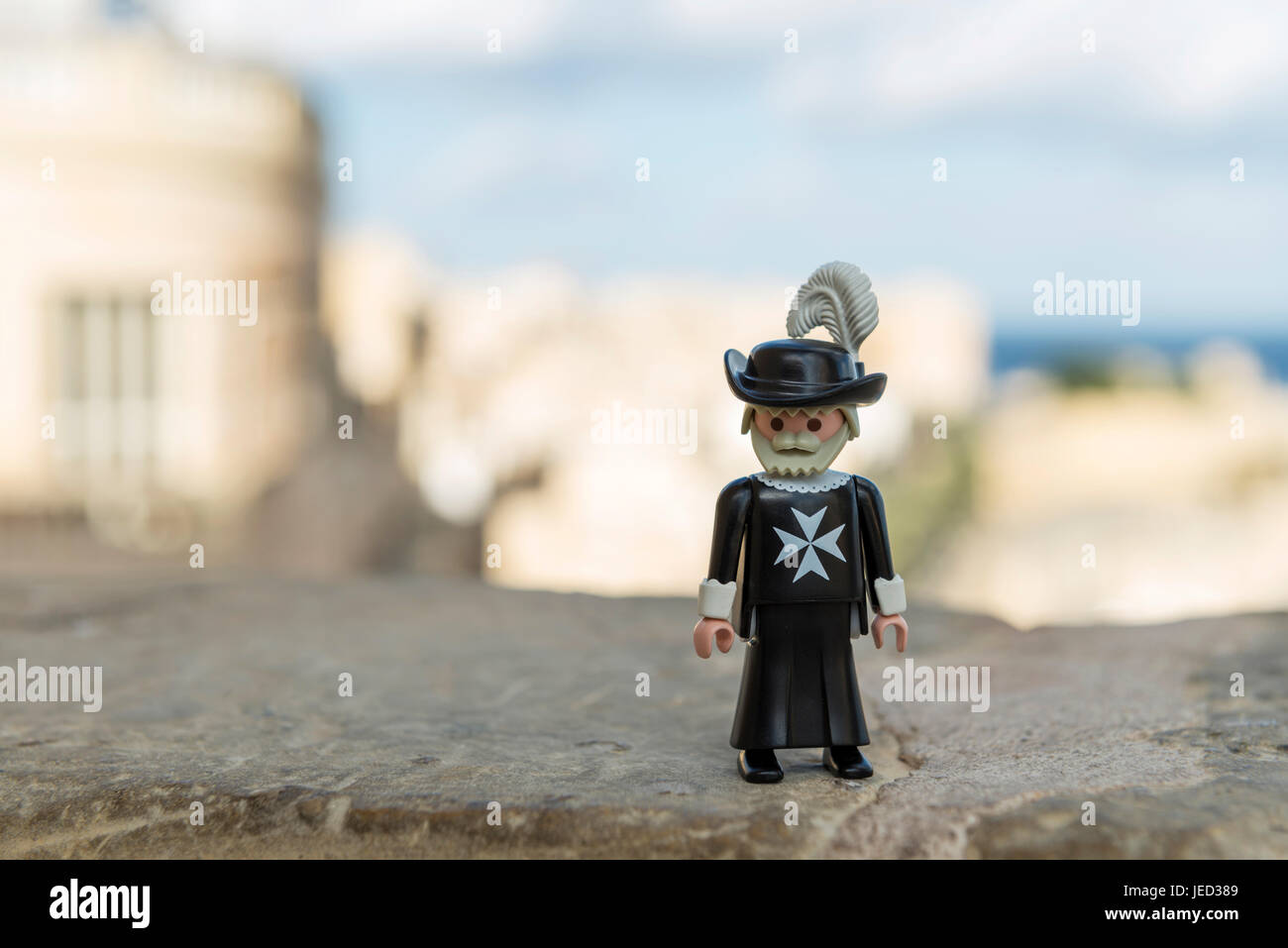 Valletta, Malta - October 11, 2016: Playmobil maltese knight with the Grand Harbour in the background. Playmobil are famous construction toys manufact Stock Photo