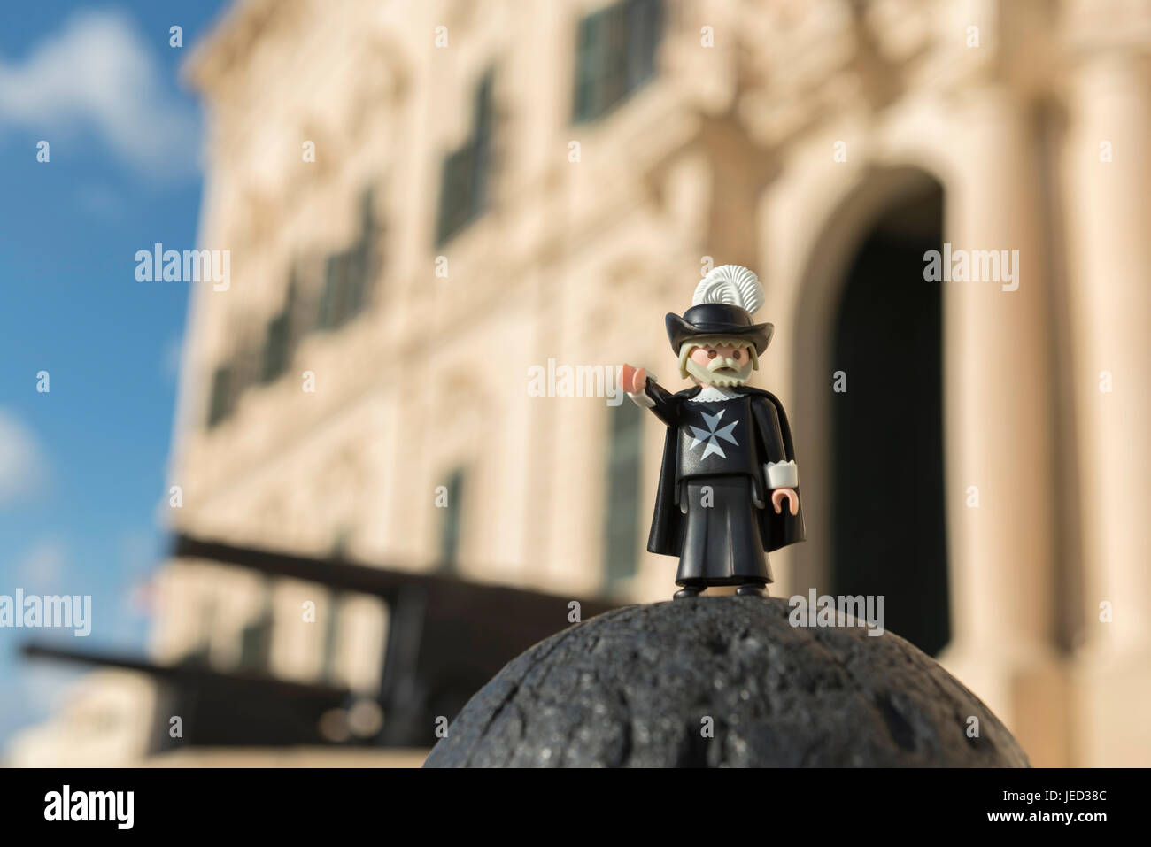 Valletta, Malta - October 11, 2016: Playmobil maltese knight with the Auberge de Castille in the background. Playmobil are famous construction toys ma Stock Photo