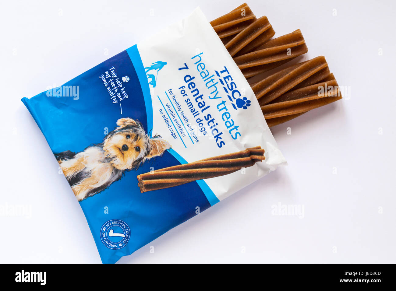 packet of Tesco healthy treats 7 dental sticks for small dogs opened to show contents set on white background Stock Photo