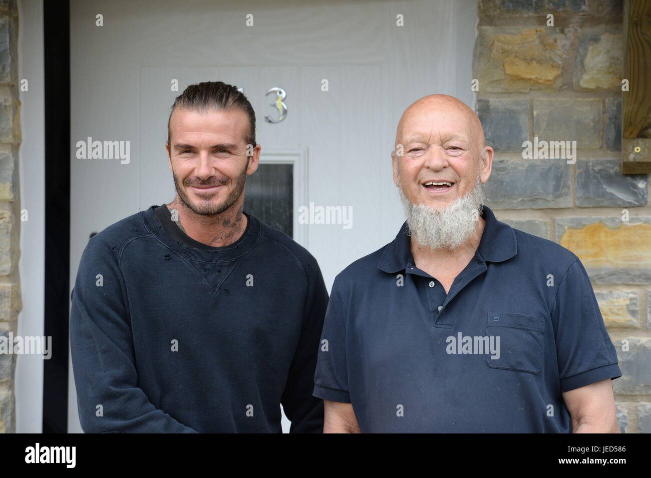 David Beckham (left) and Michael Eavis pose for photographs outside a