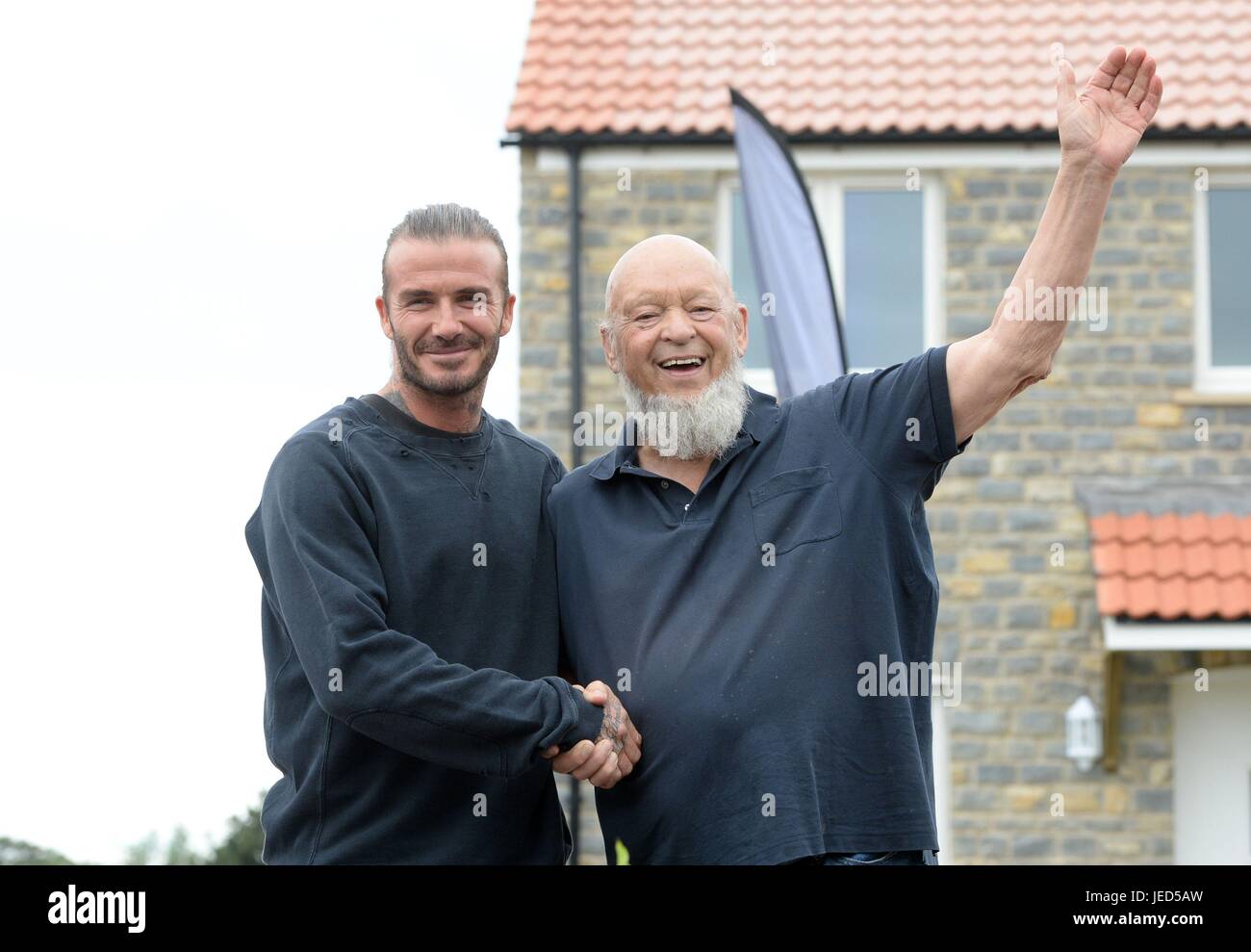 David Beckham (left) and Michael Eavis pose for photographs outside a