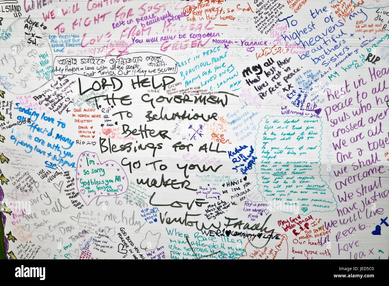 Wall of condolence in the aftermath of the fire that destroyed the 24-story Grenfell Tower in North Kensington, London on 14th June 2017.  The death toll officially at 75 but will no doubt rise to three figures. Stock Photo