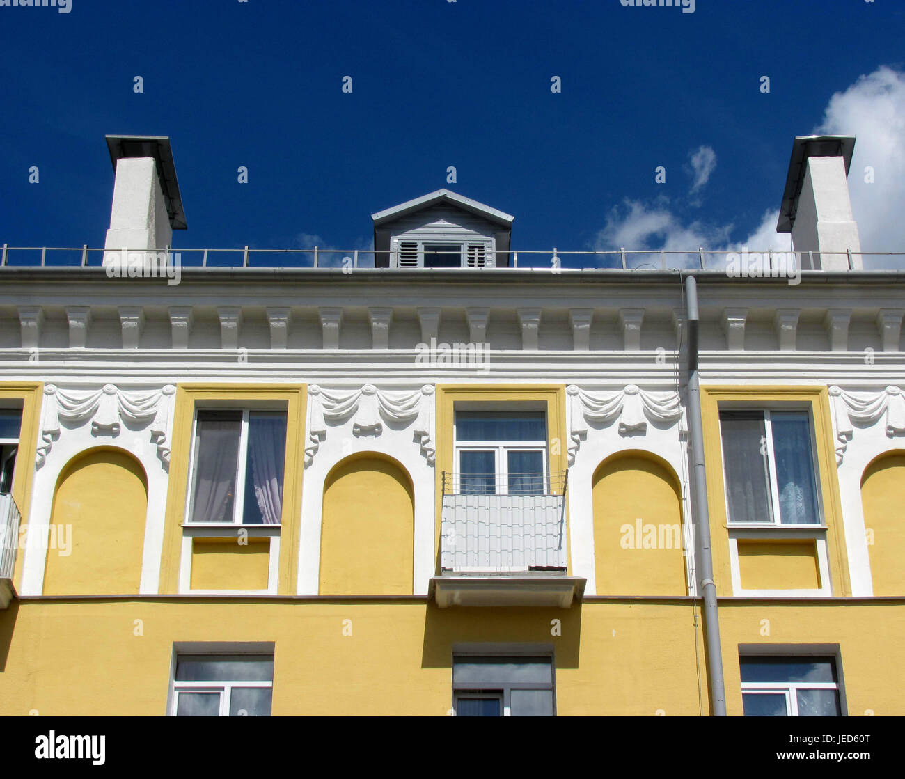 Old Soviet house after the facade reconstruction, beautiful stucco on the facade Stock Photo