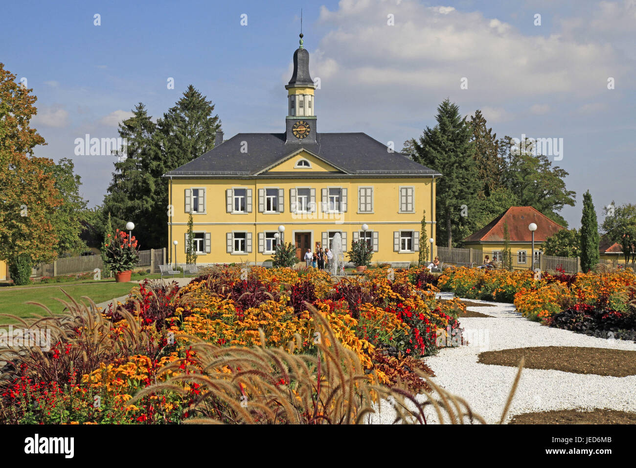 Germany, Baden-Wurttemberg, bath Rappenau, health resort park, saltworks office building, flowerbeds, house, architecture, building, yellow, garden, flowers, plants, blossom, tourists, people, tourism, saltwork office building, clock, time, Stock Photo