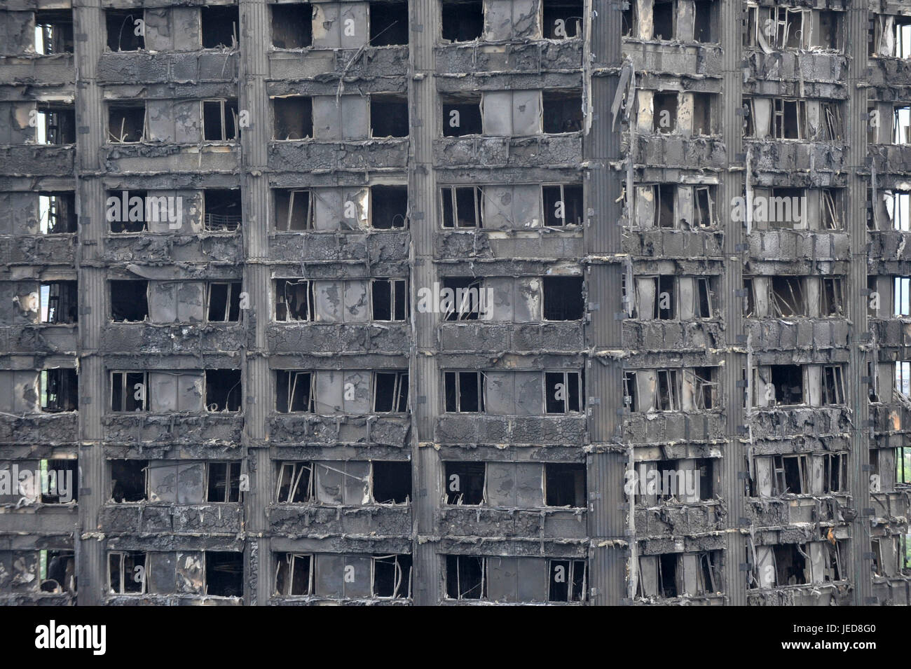 London, UK. 23rd June, 2017. Detail of the burned out shell of Grenfell ...
