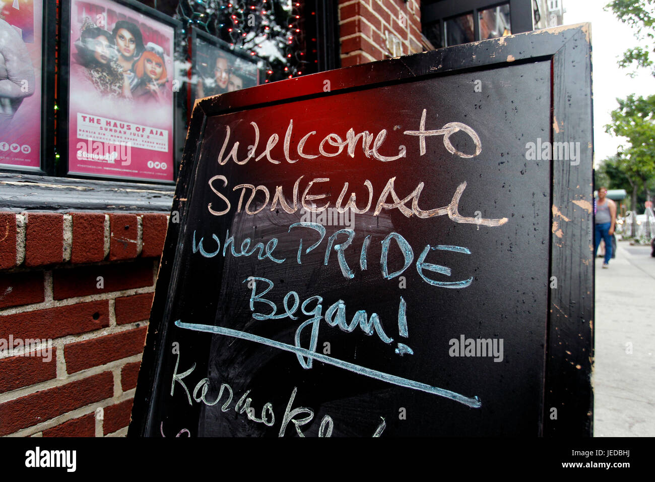 New York, USA. 23rd June, 2017. The Stonewall Inn in New York City's Greenwich Village where the Gay Pride movement was born, following a series of demonstrations in response to a police raid of the bar in 1969.  People are flocking to the site, now a National Monument, as Gay Pride events get underway in New York City this weekend, including Sunday's Pride march. Credit: Adam Stoltman/Alamy Live News Stock Photo