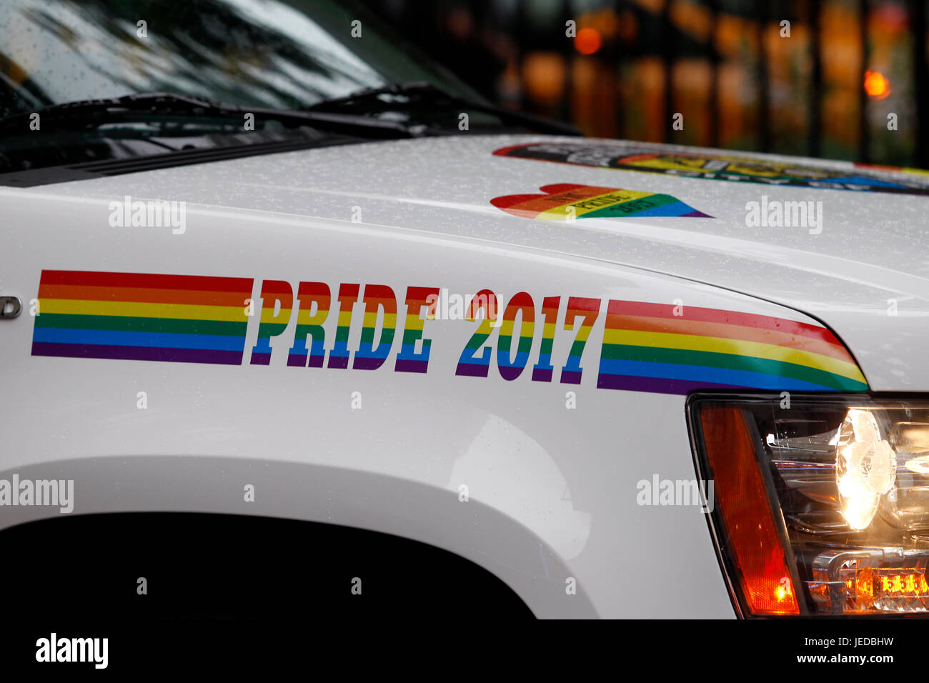 New York, USA. 23rd June, 2017. A police cruiser, in rainbow trim, stands guard in front of the Stonewall Inn in New York City's Greenwich Village where the Gay Pride movement was born, following a series of demonstrations in response to a police raid of the bar in 1969.  People are flocking to the site, now a National Monument, as Gay Pride events get underway in New York City this weekend, including Sunday's Pride march. Credit: Adam Stoltman/Alamy Live News Stock Photo