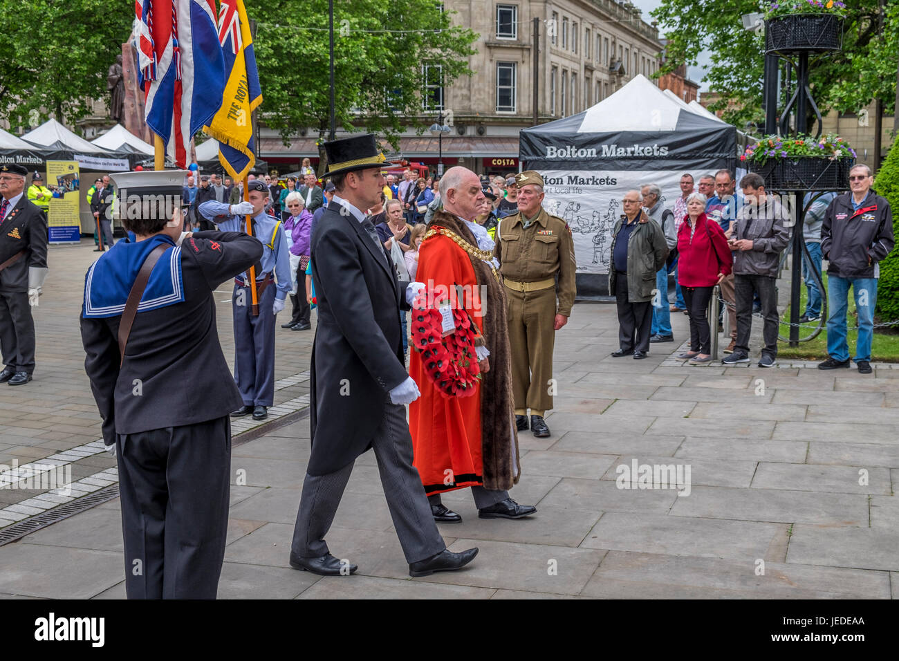 Bolton, Greater Manchester, England, UK 24th June 2017. Armed Forces Day celebrated in Bolton Town Centre with three of the forces present, Army Navy and Airforce,  The navy raised the standard just before 11:00 hours.  The groups all martched into position awaiting the arrival of the Vicar of Bolton, Bolton Mayor and other dignitaries, they all stood on the town hall steps where the vicar of Bolton conducted a small service in commemoration of the lives lost in various conflicts around the world. Credit: Mike Hesp/Alamy Live News Stock Photo