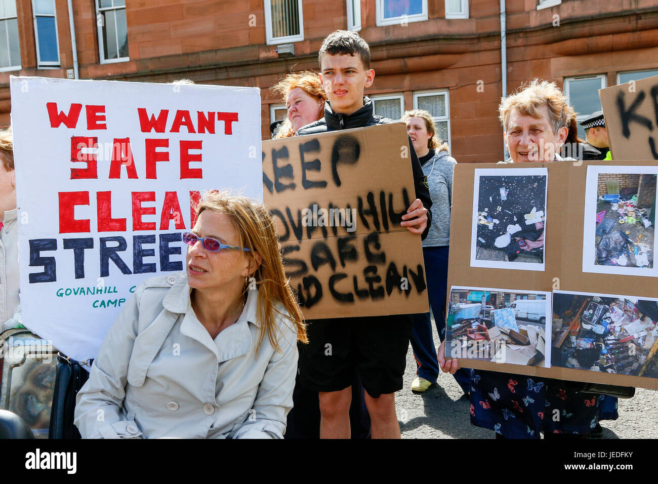 Glasgow, UK. 24th June, 2017. LIZ CROSBIE and FRANCES STOJILKOVIC from Govanhill Community Campaign lead a protest march of several hundred local residents through Govanhill, Glasgow to NICOLA STURGEON's (MSP and Scotland's First Minister) constituency office to hand in a petition demanding action be taken to make the streets safer and cleaner. This was the latest action in a long standing campaign trying to involve and get action from NICOLA STURGEON, who was unavailable and the petition was received by MHAIRI HUNTER, an SNP local counsellor on her behalf. Credit: Findlay/Alamy Live News Stock Photo