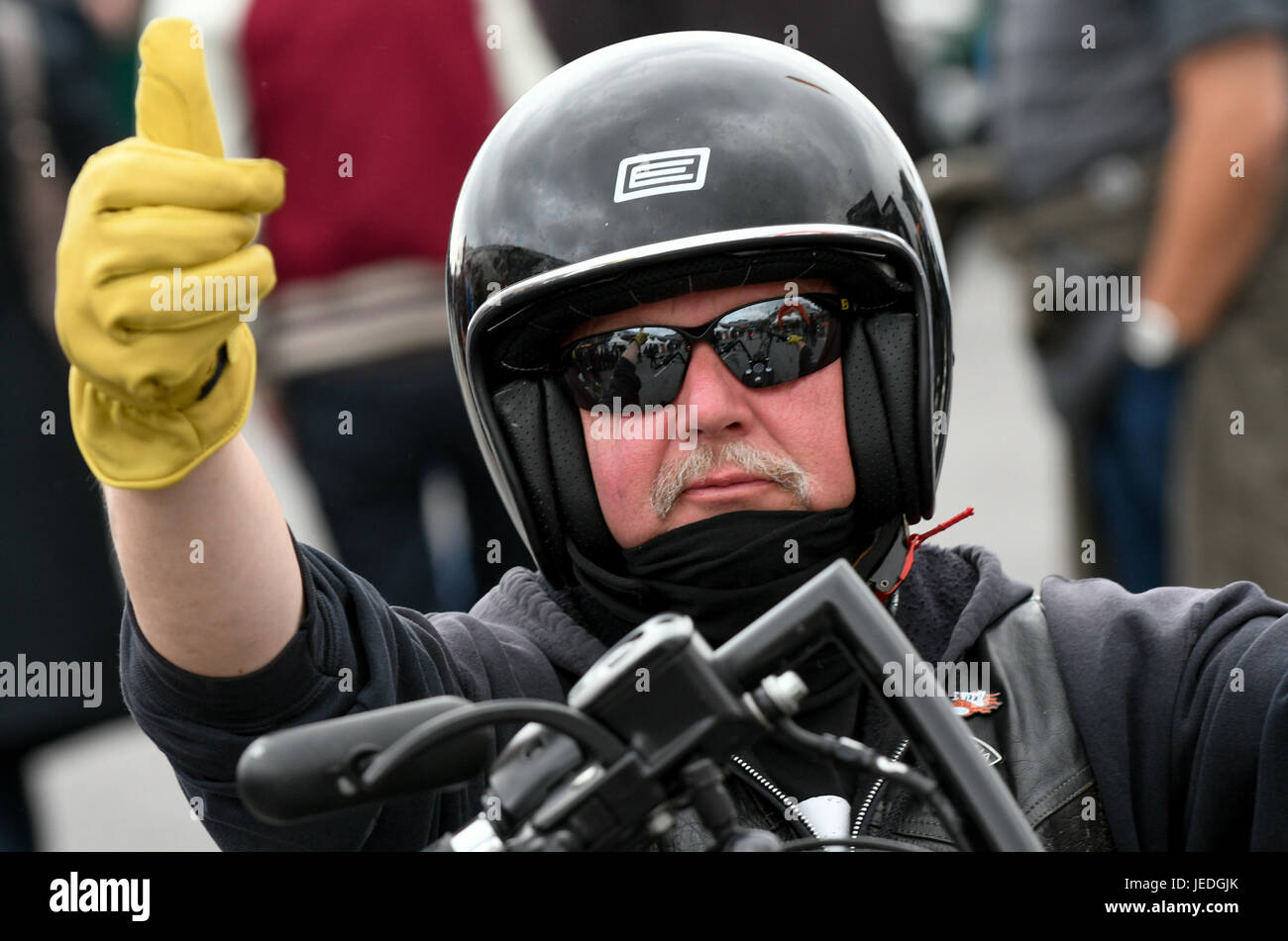 Hamburg, Germany. 24th June, 2017. A participant in the Harley Days Festival goves a thumb-up before setting off on a ride in Hamburg, Germany, 24 June 2017. Photo: Axel Heimken/dpa/Alamy Live News Stock Photo