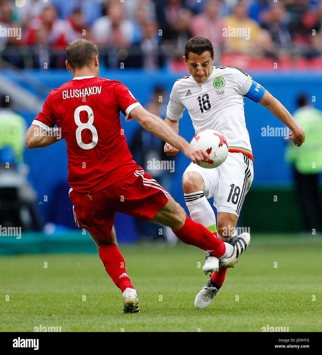 Kazan, Russia. 24th June, 2017. GLUSHAKOV Denis of Russia commits foul on GUARDADO Andres of Mexico during a match between Mexico and Russia valid for the third round of the Confederations Cup 2017, this Saturday (24) held Arena Kazan in Kazan, Russia. (Photo: Marcelo Machado de Melo/Fotoarena) Credit: Foto Arena LTDA/Alamy Live News Stock Photo