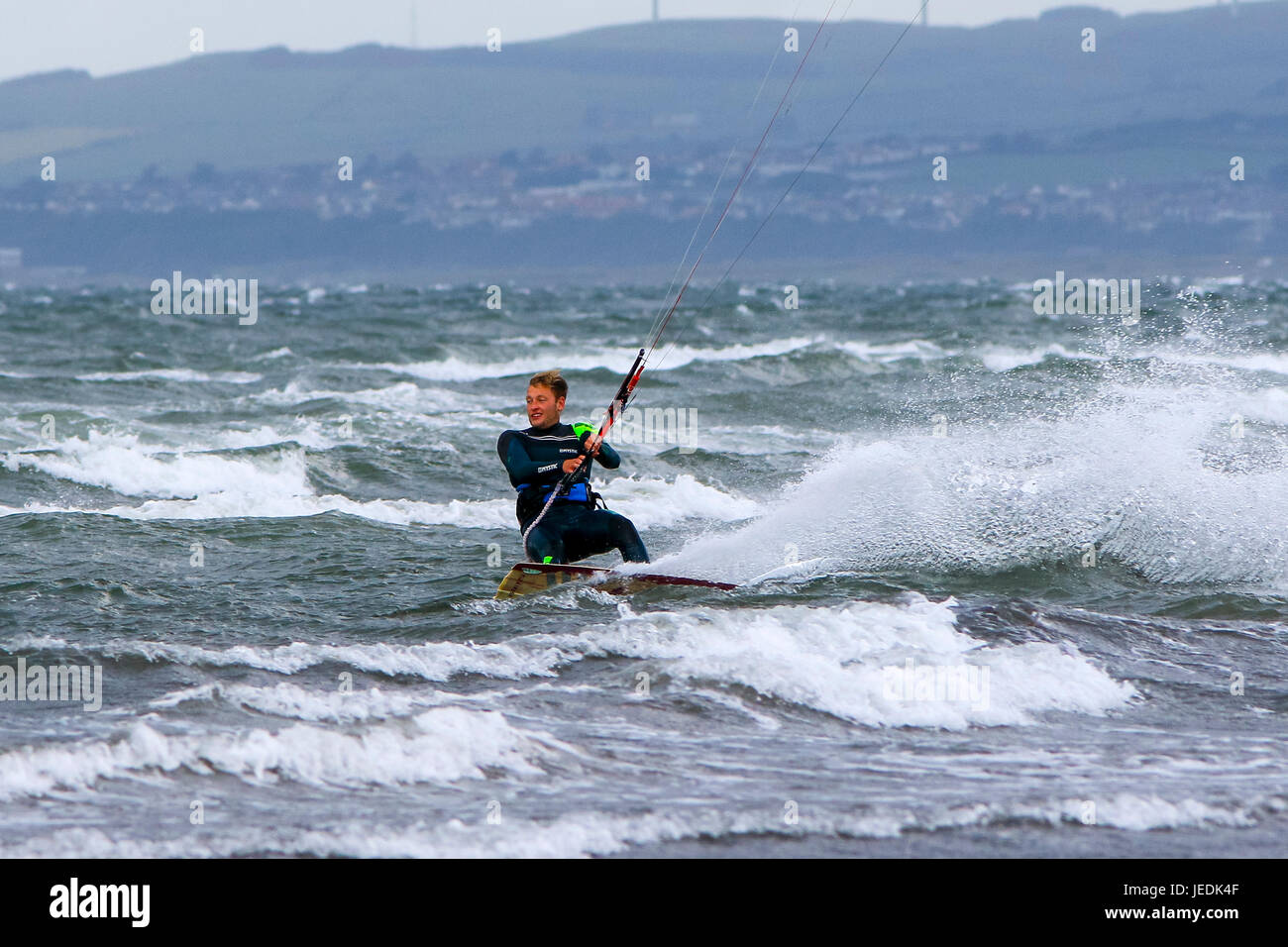 Troon, UK. 24th June, 2017. Strong winds and high waves on the Firth of Clyde at Troon, Ayrshire,  provides the perfect conditions for watersports for some. Credit: Findlay/Alamy Live News Stock Photo