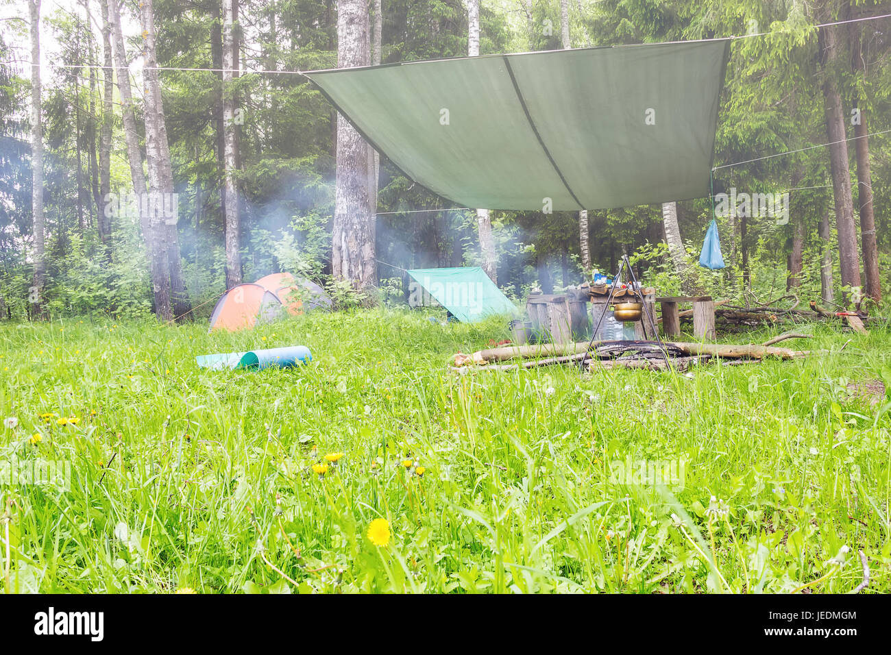 A foggy morning in a tent camp on the edge of the forest Stock Photo