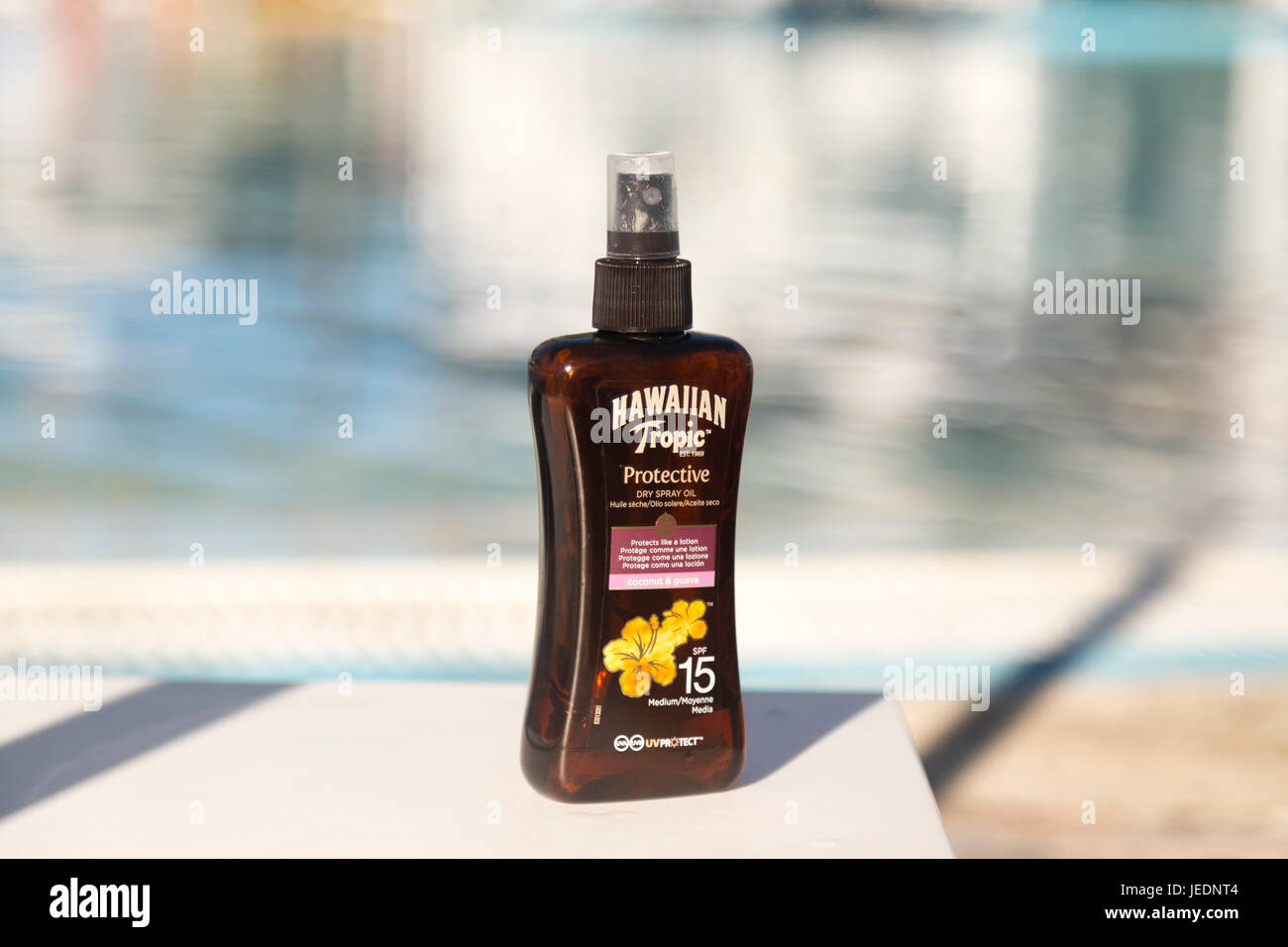 A bottle of Hawaiian tropic tanning oil next to a swimming pool Hotel Melia  Cayo Coco, Cayo Coco, Cuba Stock Photo - Alamy