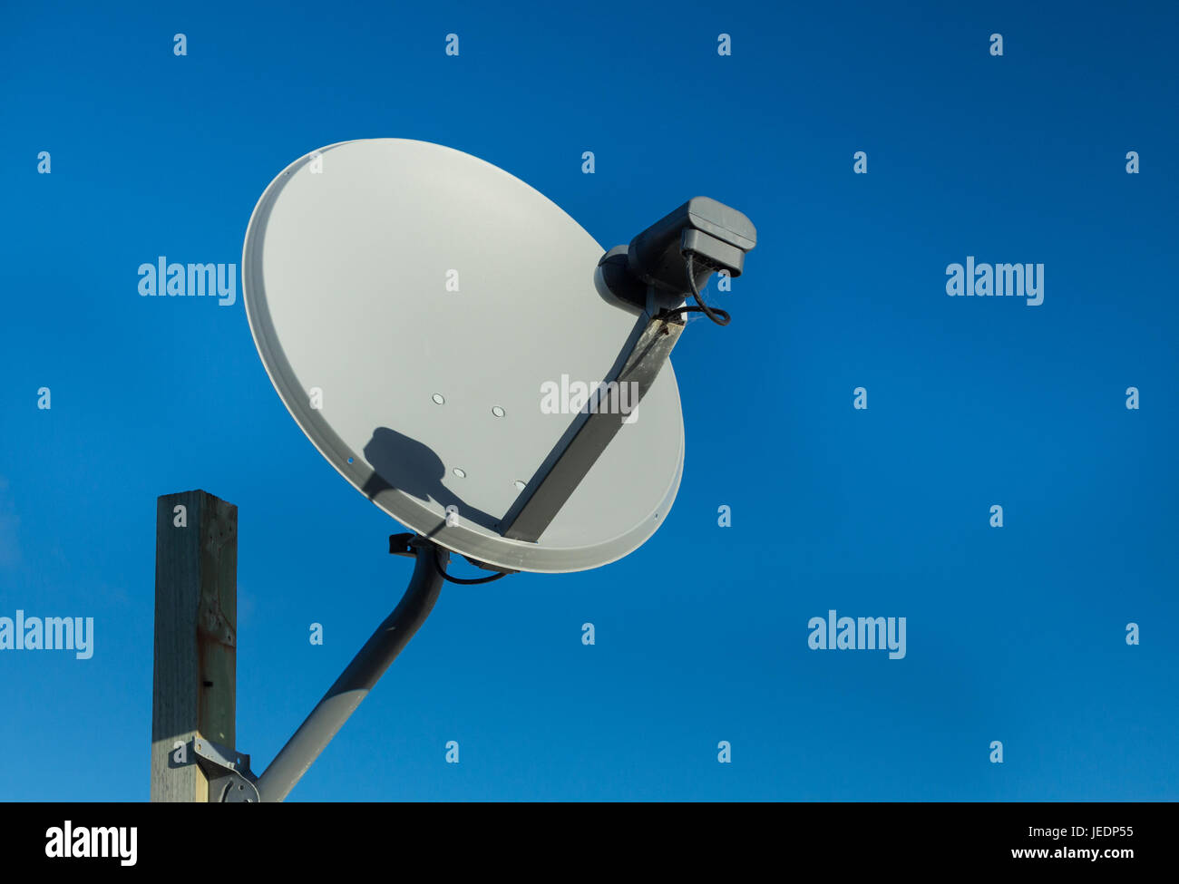 Standard satellite dish use for receiving digital Television signal. Stock Photo