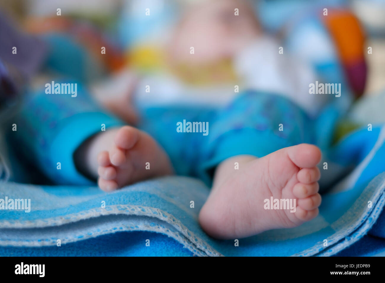 Newborn baby feet on a blue towel Stock Photo Alamy