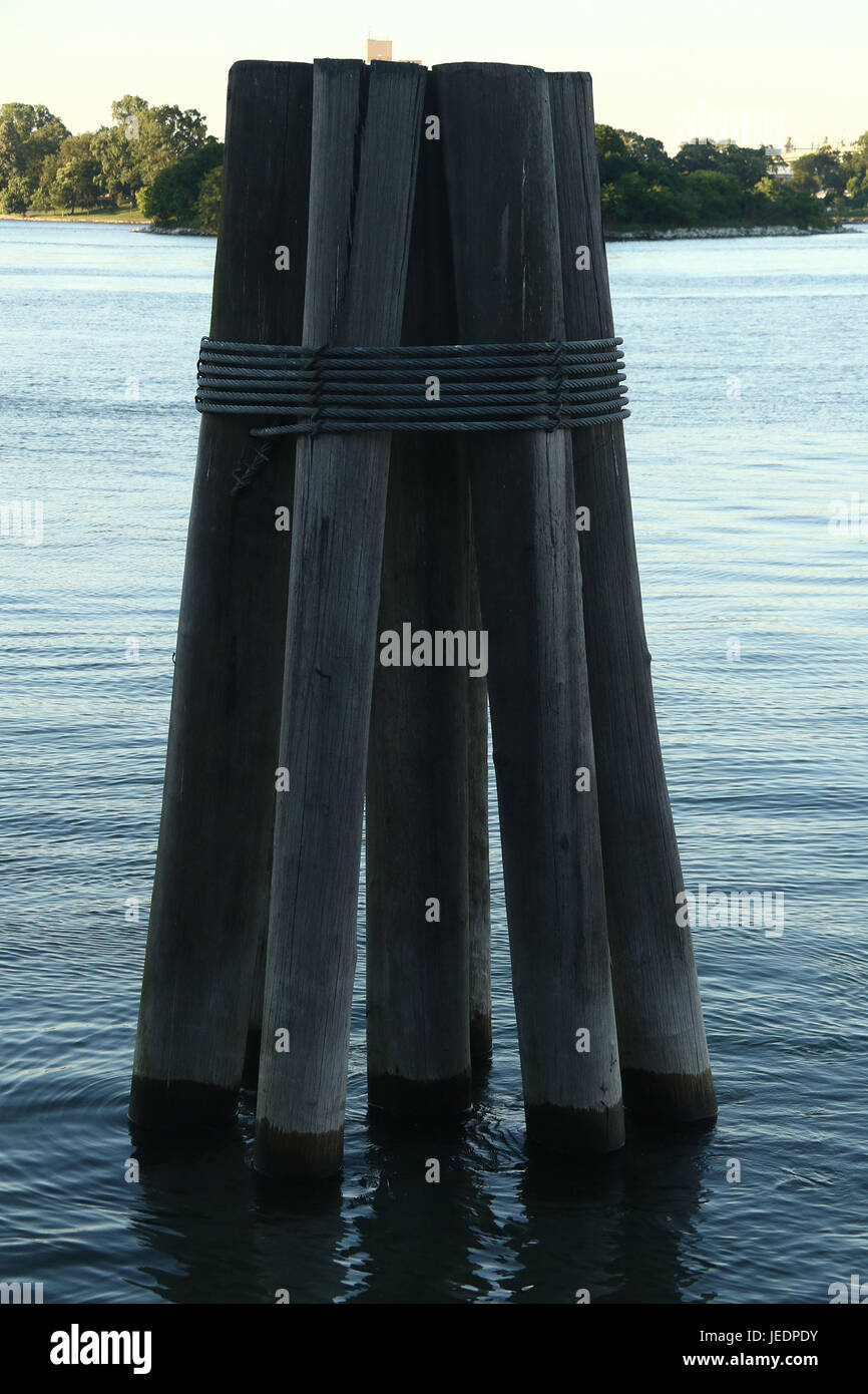 Pylons in Water at Sunset Stock Photo Alamy