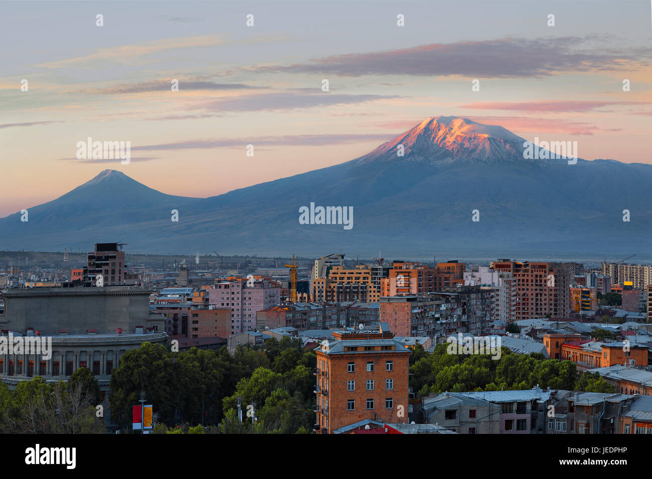 View over Yerevan at the sunrise with the two peaks of the Mt Ararat in the background, Armenia. Stock Photo