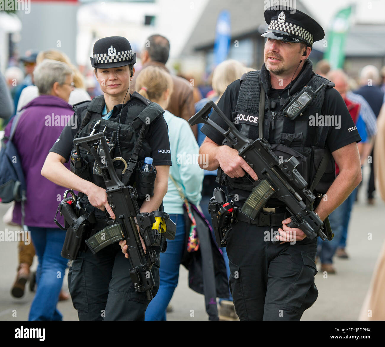 Armed police officers on patrol at the Royal Highland Show, Ingliston, Edinburgh. Stock Photo