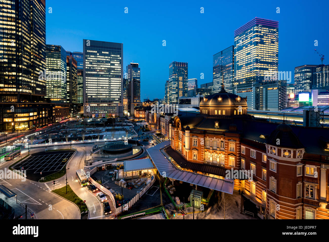 Tokyo railway station and Tokyo highrise building at twilight time in Tokyo, Japan. Stock Photo
