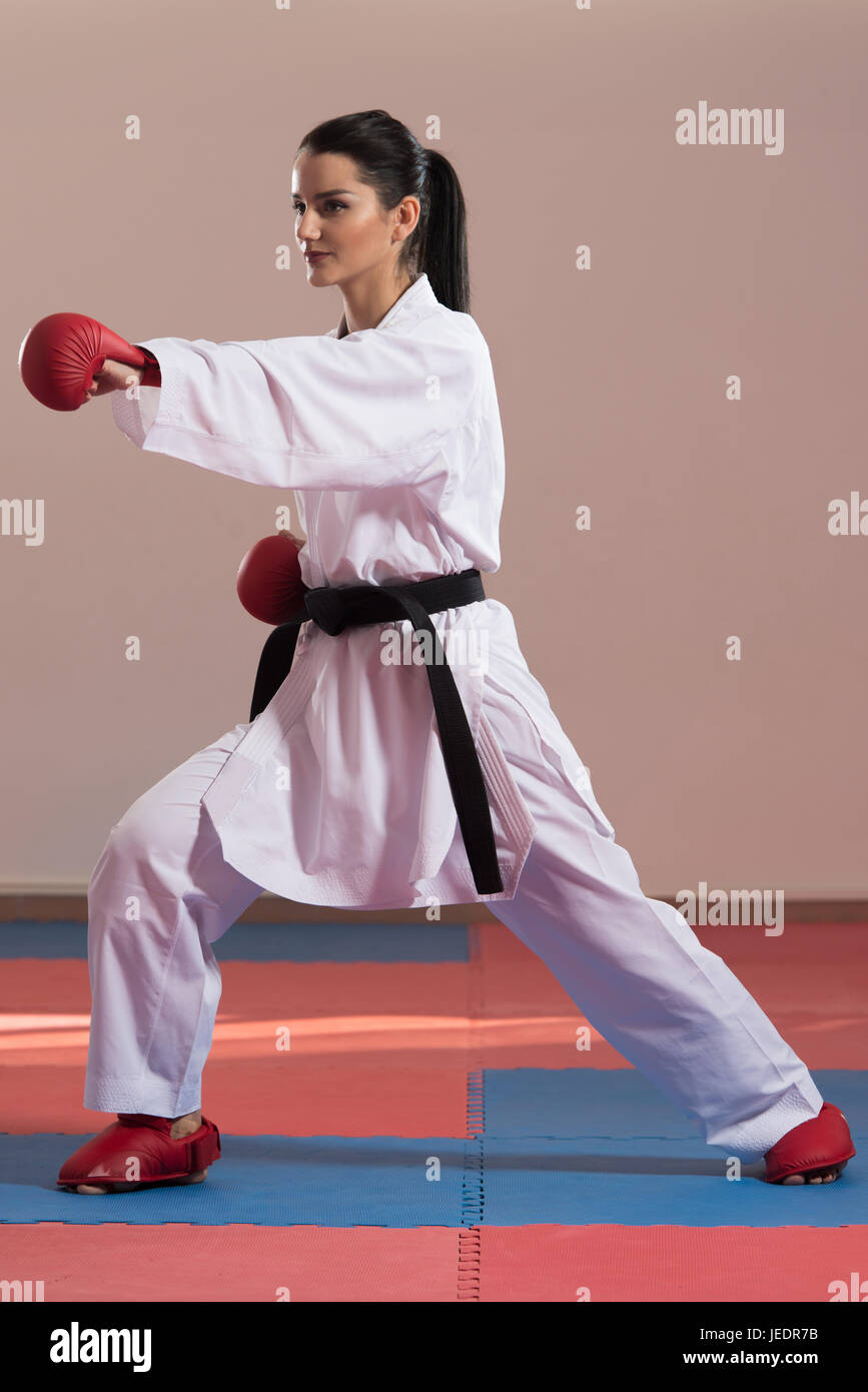 Young Woman Practicing Her Karate Moves White Kimono Black Belt Stock Photo Alamy