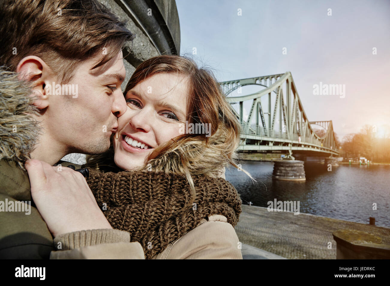 Young couple kissing at glienicke bridge hi res stock photography and